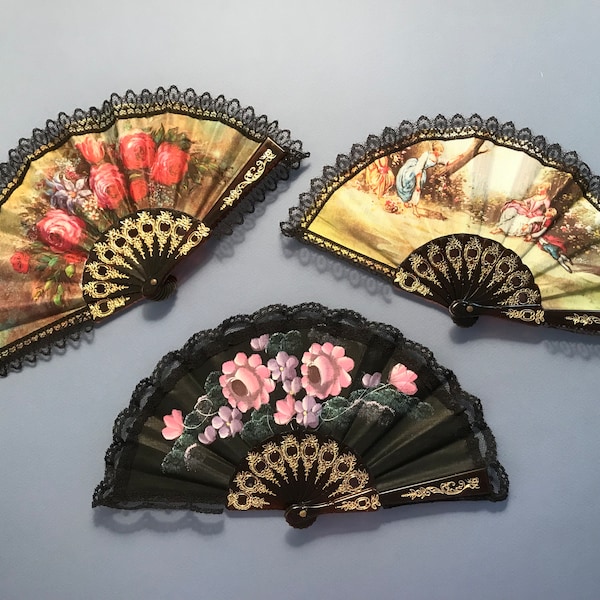 Little vintage fans handmade in Spain, assorted, 5” x 10” when open. 5" x 1" closed and fit for purse or pocket. Brand new condition.