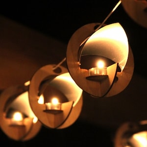 Skyboats: Hanging Lantern String Lights.  Tealight Candle Lit kits with tin roof reflectors. Outdoor Party Lights!