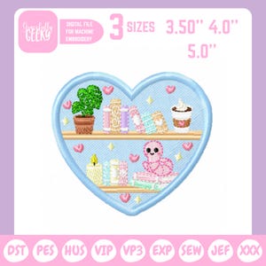 May include: An embroidered heart-shaped design featuring a bookshelf with a potted plant, books, a candle, a coffee cup, and a pink creature. The design includes the text "DIGITAL FILE FOR MACHINE EMBROIDERY" and "3 SIZES 3.50", 4.0", 5.0".
