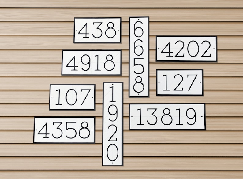 Multiple house number signs of the same style are mounted to a large wall of vinyl siding. The sizes of the plaques are different, as are the quantity of numbers on each plaque. A variety of signs with different digits and orientations for reference.