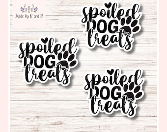May include: Three black and white stickers with the text "spoiled DOG treats" in a script font, with a paw print design. The stickers are on a light wood grain background. The top left corner has the text "Made by R and R".