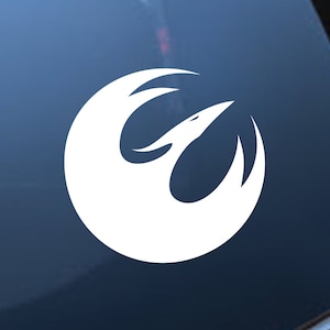 May include: White Rebel Alliance symbol decal. The symbol is a stylised bird with wings outstretched. The decal is perfect for adding a touch of Star Wars fandom to your car, laptop, or other surfaces.