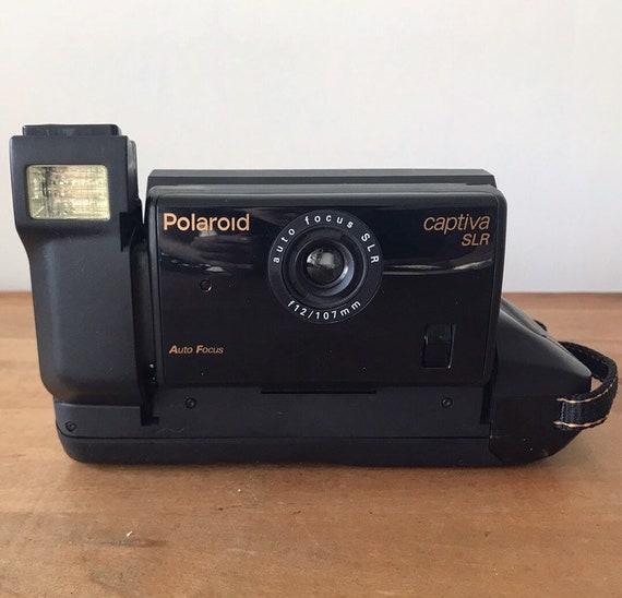 Currently NOT Shipping. Please see full item description. Polaroid Captiva SLR Folding Instant Film Camera, photography