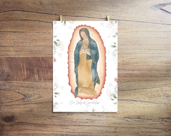 May include: Watercolor print of Our Lady of Guadalupe, featuring a figure in a blue cloak and gold dress, hands clasped in prayer. The image is set against a soft, glowing background with a floral border, and the text "Our Lady of Guadalupe" is at the bottom.
