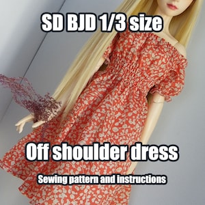May include: Off-shoulder dress sewing pattern and instructions for SD BJD 1/3 size dolls. The dress is red with a white floral print.