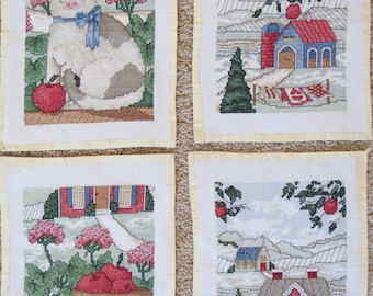 Set of 4 apple-themed cross stitch pieces