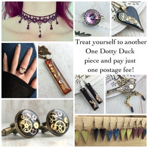 May include: A collage of handmade jewelry including a purple lace choker, rings, necklaces, earrings, and cufflinks. The jewelry features gears, hearts, and other decorative elements. The text in the image says "Treat yourself to another One Dotty Duck piece and pay just one postage fee!"