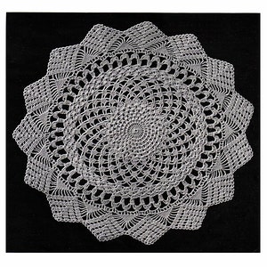 May include: A white crocheted doily with a circular design. The doily has a scalloped edge and a center with a spiral pattern.  D'Oyley No. 4.