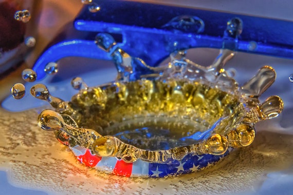 Pop the Top Off (Metal Panel) Beer dripping into a beer bottle cap