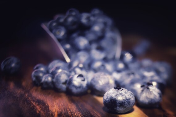 Blueberry Spill (CANVAS) Dark food photography of blueberries spilled on a wood table