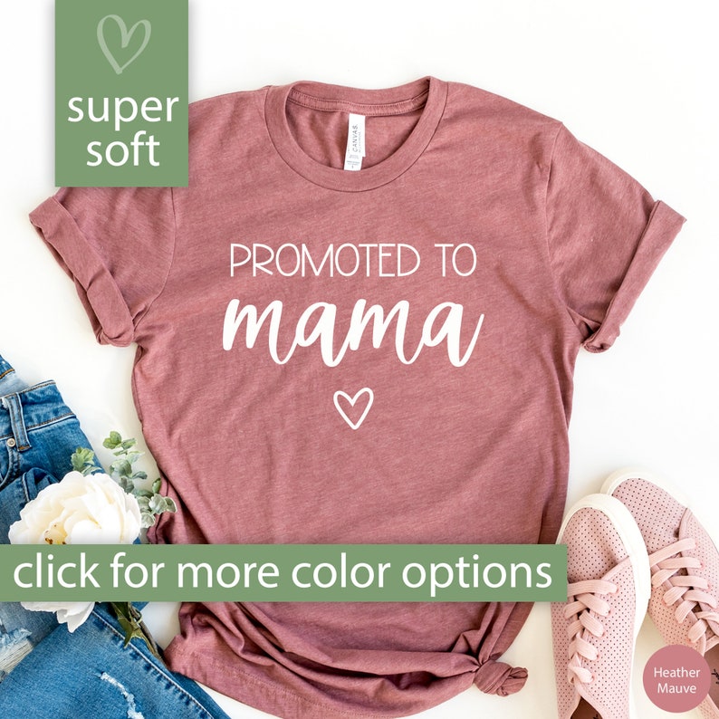 May include: A heather mauve t-shirt with the text "PROMOTED TO mama" in white with a small heart below the text. The shirt is super soft and has a relaxed fit. Click for more color options.