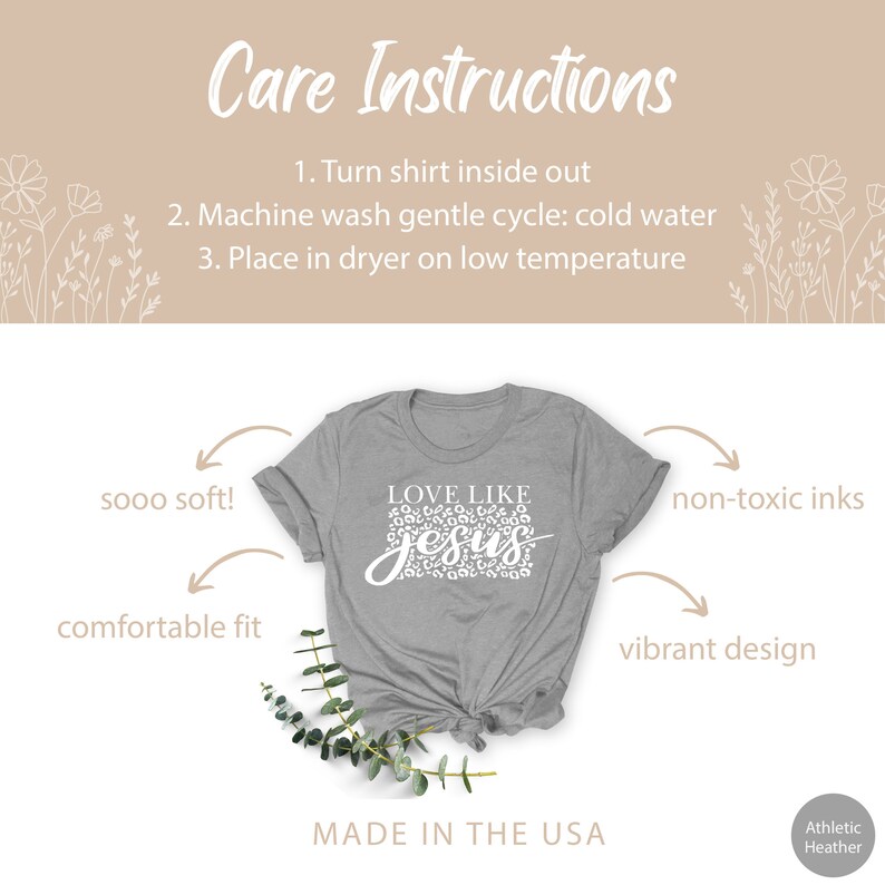 Pode incluir: Uma camiseta cinza com um gr&aacute;fico branco que diz "LOVE LIKE JESUS" em um design de estampa de leopardo. A camiseta &eacute; feita nos EUA e apresenta um caimento confort&aacute;vel, um tecido macio e tintas n&atilde;o t&oacute;xicas.