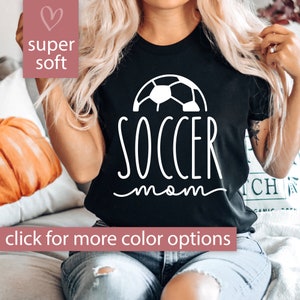 May include: Black t-shirt with a white soccer ball graphic and the text "soccer mom" in white script.