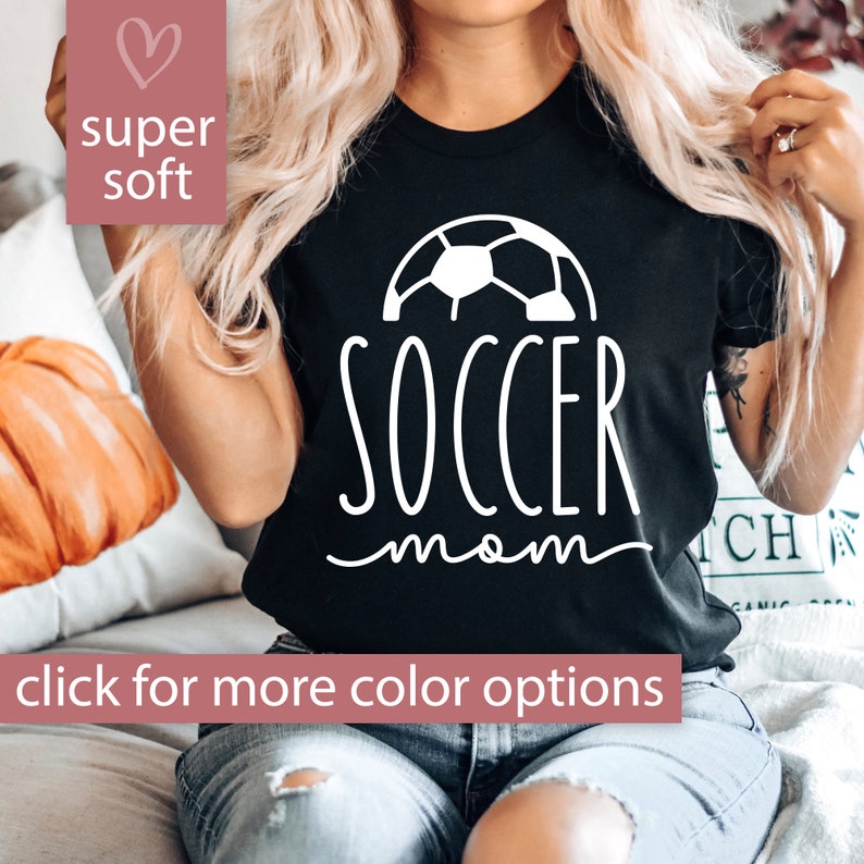 May include: Black t-shirt with a white soccer ball graphic and the text "soccer mom" in white script.