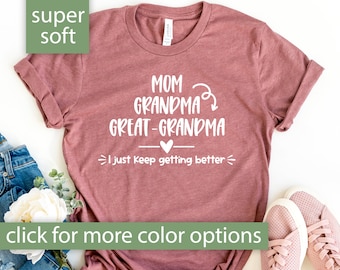 May include: Heather mauve t-shirt with the text "Mom Grandma Great-Grandma I just keep getting better" in white.
