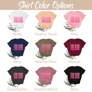 May include: A chart showing different t-shirt colors with the text "Yee Haw" printed on each shirt. The colors include white, heather peach, pink, navy, heather olive, maroon, grey heather, heather mauve, and black.