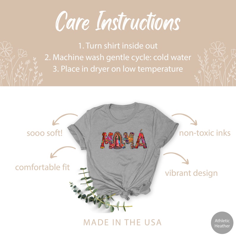 May include: A gray t-shirt with the word "MAMA" printed in colorful, intricate lettering. The shirt is made in the USA and features a comfortable fit, soft fabric, and non-toxic inks. Care instructions are provided for washing and drying the shirt.