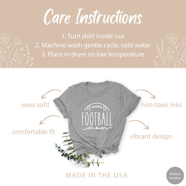 May include: A gray t-shirt with the text "FOOTBALL mom" in white lettering. The shirt is shown on a white background with a floral design and text that reads "Care Instructions" and "Made in the USA".