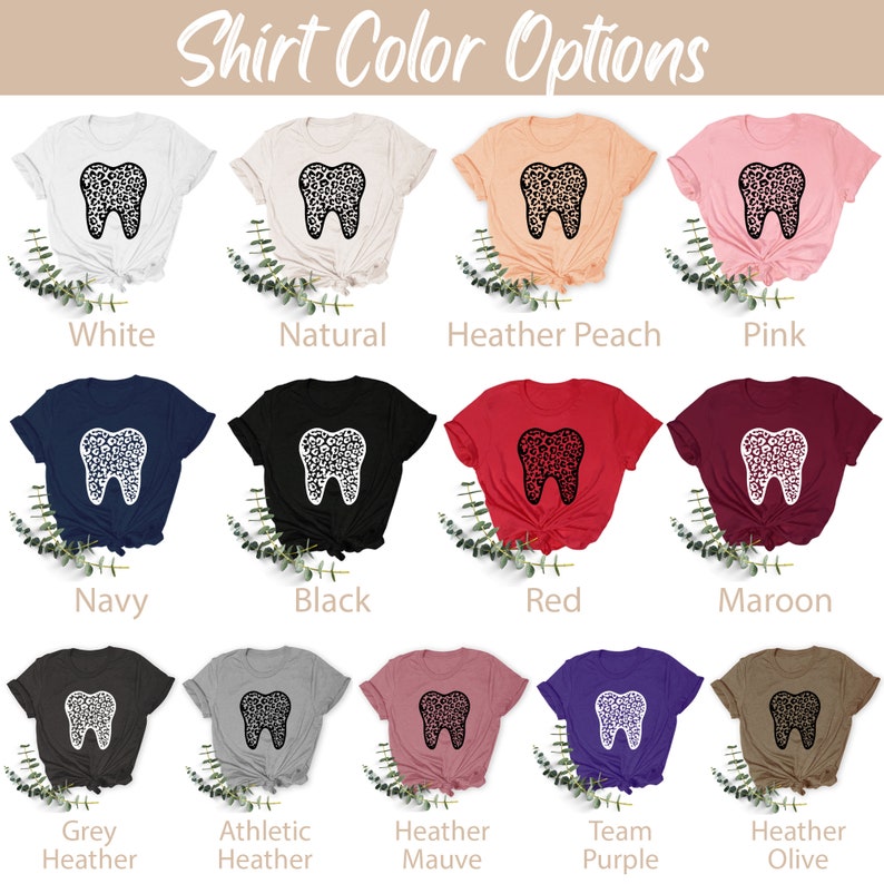 May include: A selection of t-shirts in various colors, featuring a white tooth with a leopard print design. The colors include white, natural, heather peach, pink, navy, black, red, maroon, grey heather, athletic heather, heather mauve, team purple, and heather olive.