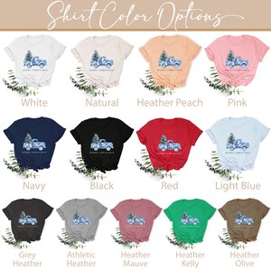 May include: A selection of t-shirt colors with a Christmas truck design. The colors include white, natural, heather peach, pink, navy, black, red, light blue, grey heather, athletic heather, heather mauve, heather kelly, and heather olive.
