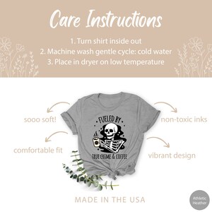 May include: Gray t-shirt with a black and white graphic of a skeleton holding a coffee mug. The graphic says "Fueled by True Crime & Coffee".