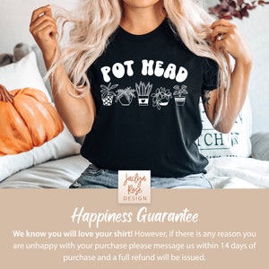 May include: Black t-shirt with white text that reads "POT HEAD" and a row of six potted plants. The shirt is being worn by a person with long blonde hair. The text "Jaclyn Rose DESIGN" is in a white square on a brown background.