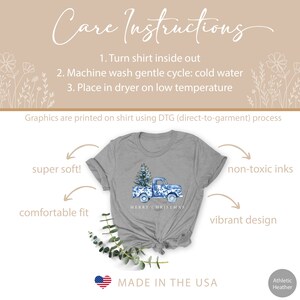 May include: A gray t-shirt with a blue and white watercolor design of a pickup truck carrying a Christmas tree. The text "Merry Christmas" is printed below the truck. The shirt is made in the USA and is super soft, comfortable, and features non-toxic inks.