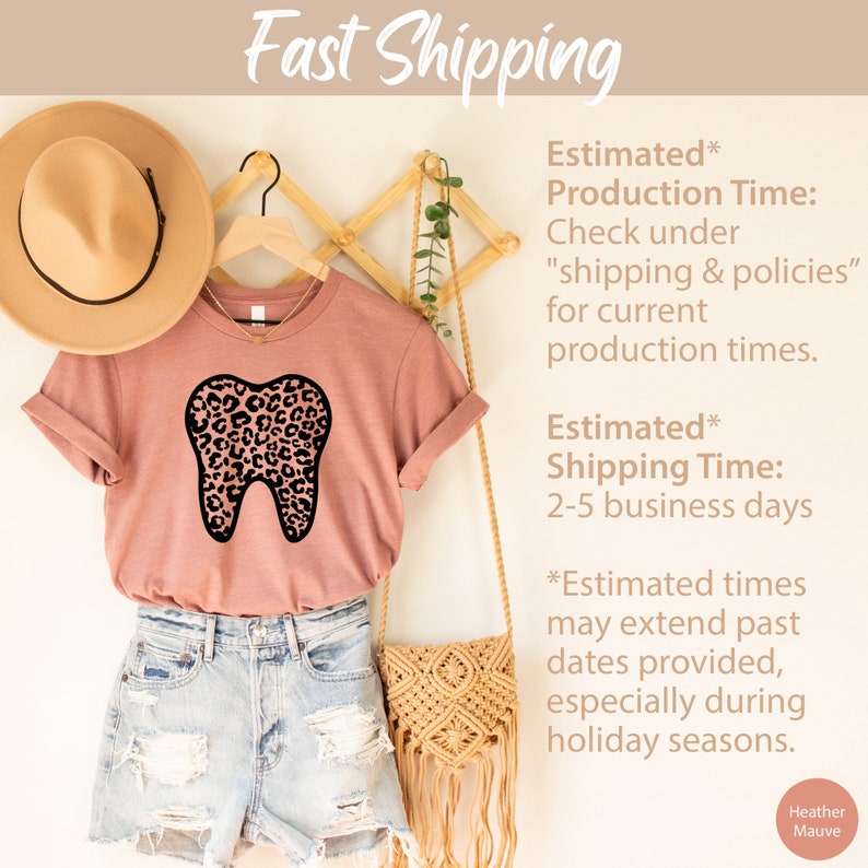May include: A heather mauve t-shirt with a black and pink leopard print tooth graphic. The text "Fast Shipping" is at the top of the image. The text "Estimated* Production Time: Check under "shipping & policies" for current production times." is on the right side of the image. The text "Estimated* Shipping Time: 2-5 business days" is also on the right side of the image. The text "*Estimated times may extend past dates provided, especially during holiday seasons." is on the right side of the image. The text "Heather Mauve" is at the bottom right of the image.