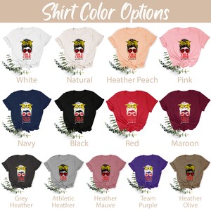 May include: A graphic showing different t-shirt colors available for purchase. The t-shirts feature a graphic of a woman with a messy bun, sunglasses, and the words "True Crime" written on the shirt. The colors shown are white, natural, heather peach, pink, navy, black, red, maroon, grey heather, athletic heather, heather mauve, team purple, and heather olive.