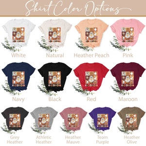K&ouml;nnte beinhalten: Eine Collage von T-Shirt-Farboptionen mit einem Motiv eines Geistes mit dem Text "I'm Spooky" in einem Patchwork-Design. Die Farben umfassen Wei&szlig;, Natur, Heidelbeer-Pfirsich, Rosa, Marineblau, Schwarz, Rot, Rotbraun, Grau-Melange, Athletik-Melange, Flieder-Melange, Team-Lila und Oliv-Melange.