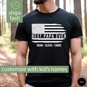 May include: Black t-shirt with a distressed American flag design and the text "BEST PAPA EVER" with a space for three names. The names shown are "NOAH - OLIVIA - EMMA".