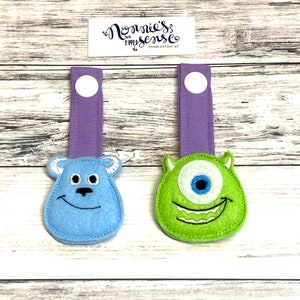 MONSTERS Reikriemen en dragerbedels. Tula. Boba. Pikkolo. Lillebaby. Blije baby. Kinderpakket. Ontdekken. Vrij om te groeien. Tula geweven.