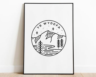 May include: Black and white line art print of a mountain range with a river and trees. The text "YR WYDDFA" is written in a circle around the mountain.