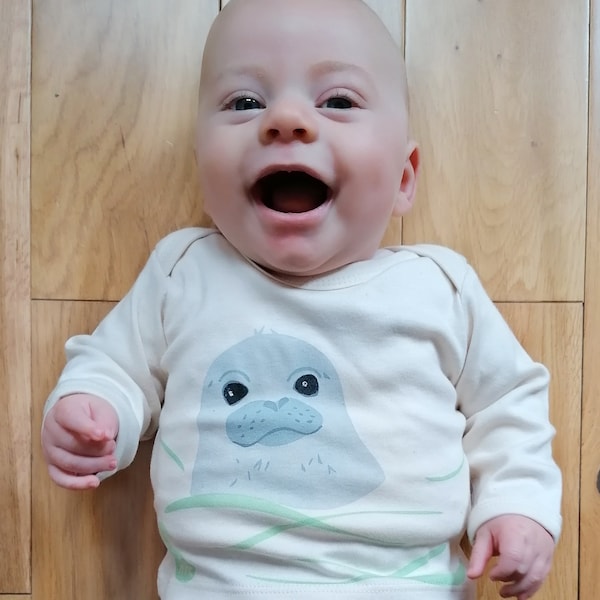 Swimming seal pup organic cotton baby sleepsuit. Baby grow. Pyjamas. Baby boy or baby girl gift.