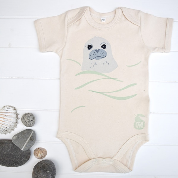 Baby bodysuit in organic cotton with a swimming seal pup, water baby, baby boy or baby girl gift.