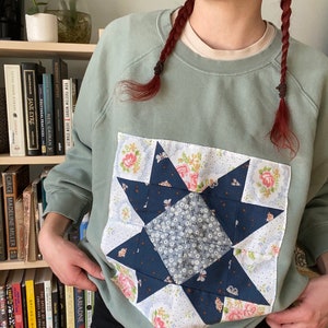 Green quilt block sweater