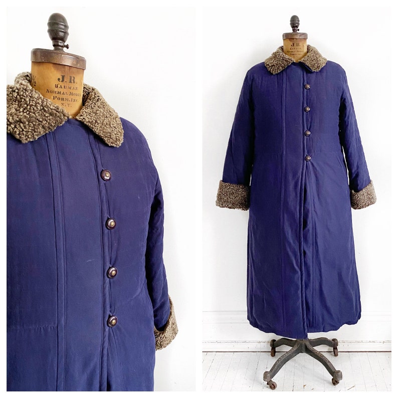 Navy sueded long down filled puffer jacket with fur trim Size LXL.