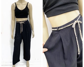 Black pleat front rayon crinkle pants with elastic back waistband. Size L.