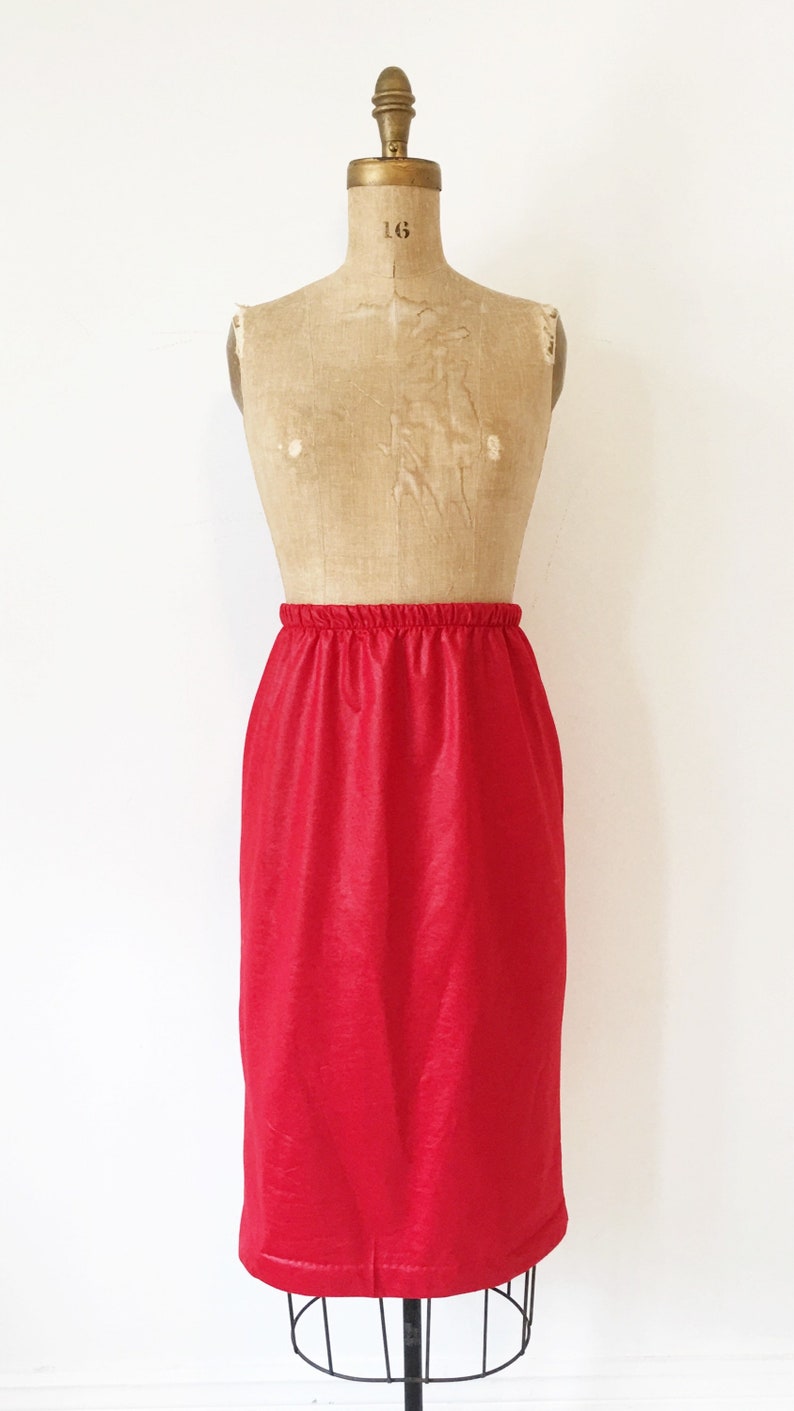 Red leather look high waisted pencil skirt with elastic waistband Size M.