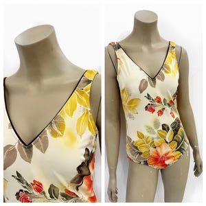 Sweet butter yellow floral one piece bathing suit with full coverage. Size S/M.