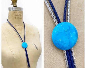 Cool turquoise bolo tie with double leather cords.