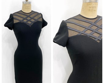 Chic sheer illusion neckline stretch little black dress. Size M/L.