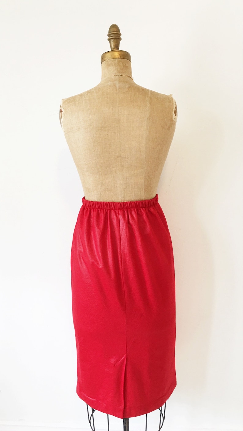Red leather look high waisted pencil skirt with elastic waistband Size M.