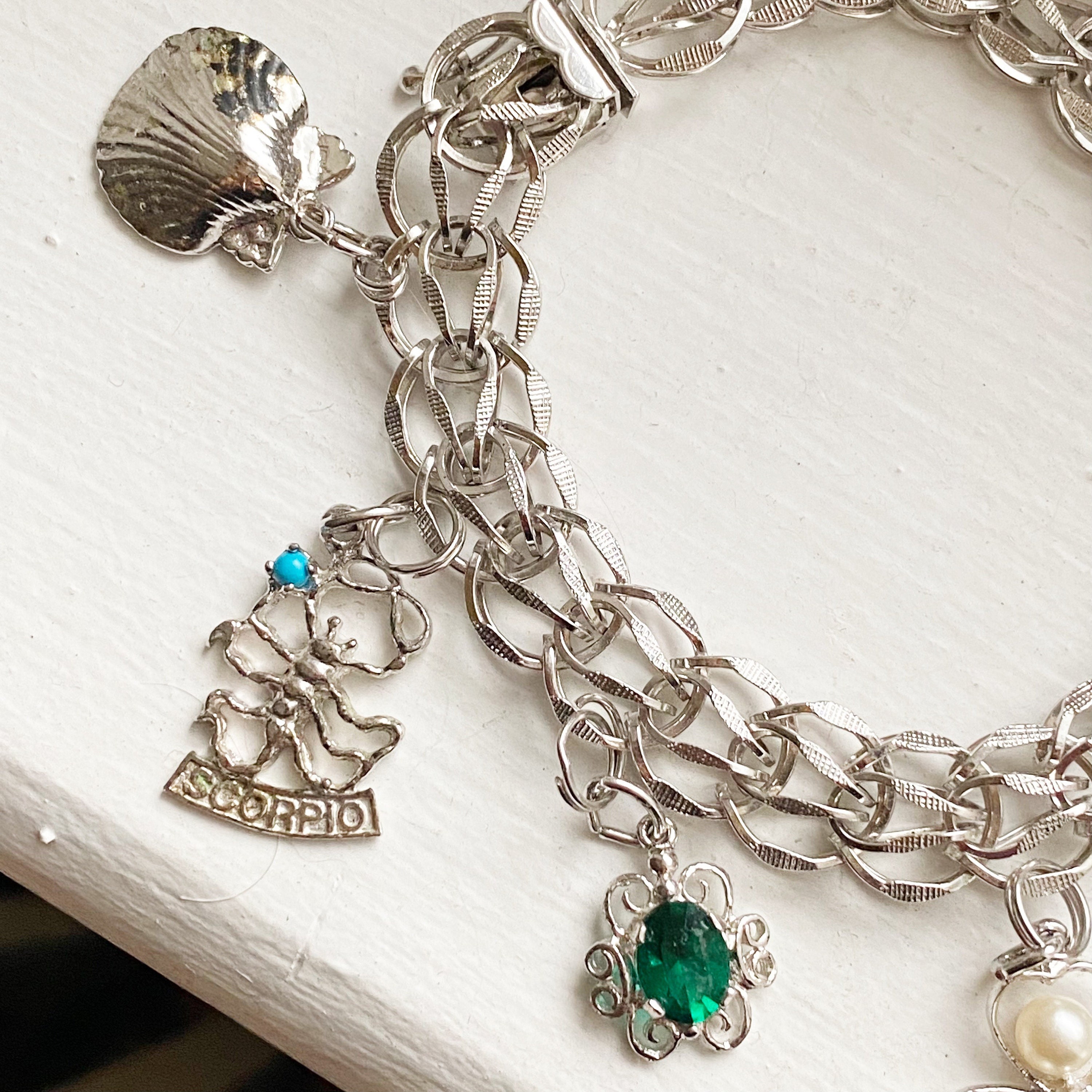 Sterling Charm Bracelet with Assorted Charming Charms.