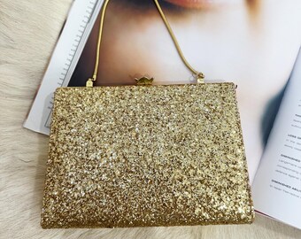 1960's gold sparkle vinyl clutch. Made in Canada.