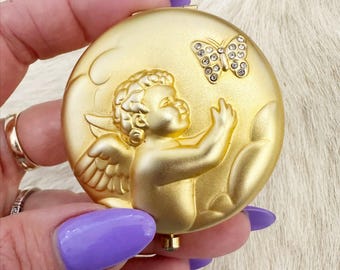 Estée Lauder August Angel gold rhinestone mirrored compact.