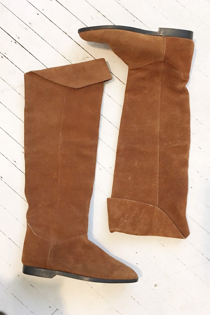 Size 66.5. Brown suede knee high flat walking boots