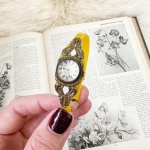 Antique celluloid and brass kids (fits women) watch bracelet.