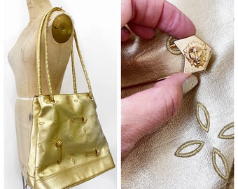 Amazing glam 1990's gold faux leather shoulder bag with lion safety pins.