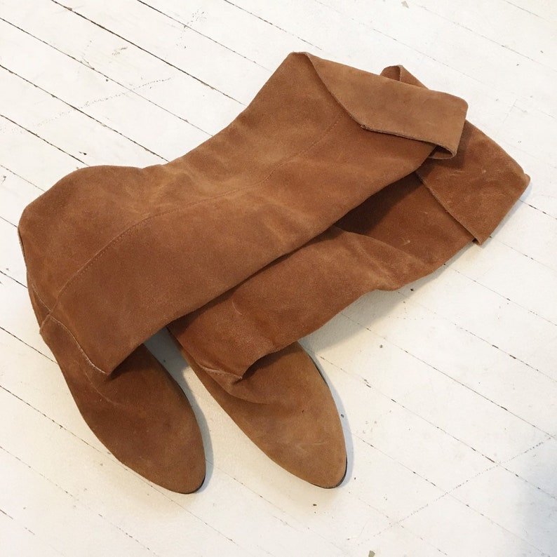 Size 66.5. Brown suede knee high flat walking boots